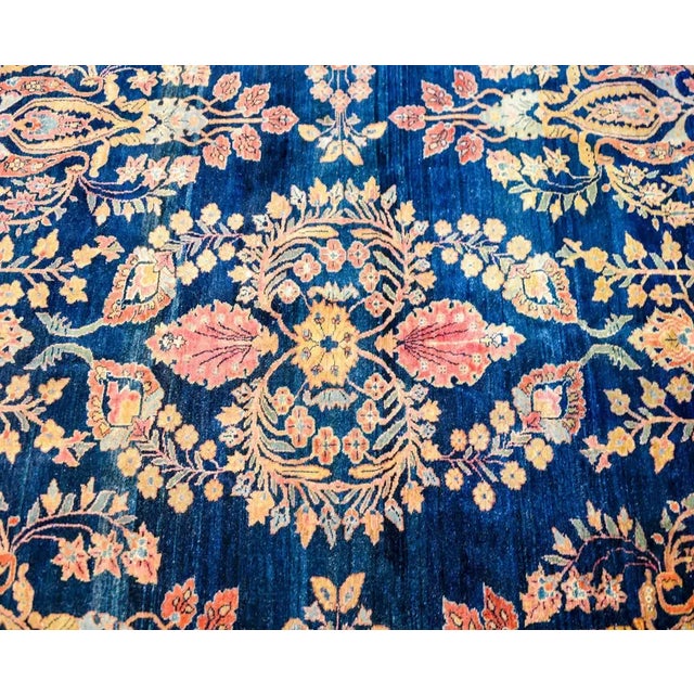 A remarkable Persian Sarouk Maharajan rug with an exquisite all-over mirrored floral and tree-of-life pattern woven in...