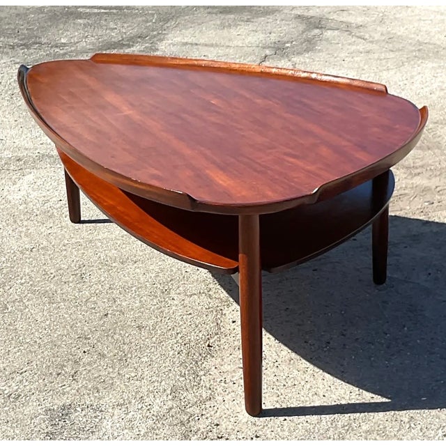 This vintage mid-century modern surfboard coffee table is a striking example of Scandinavian design, crafted by celebrated...
