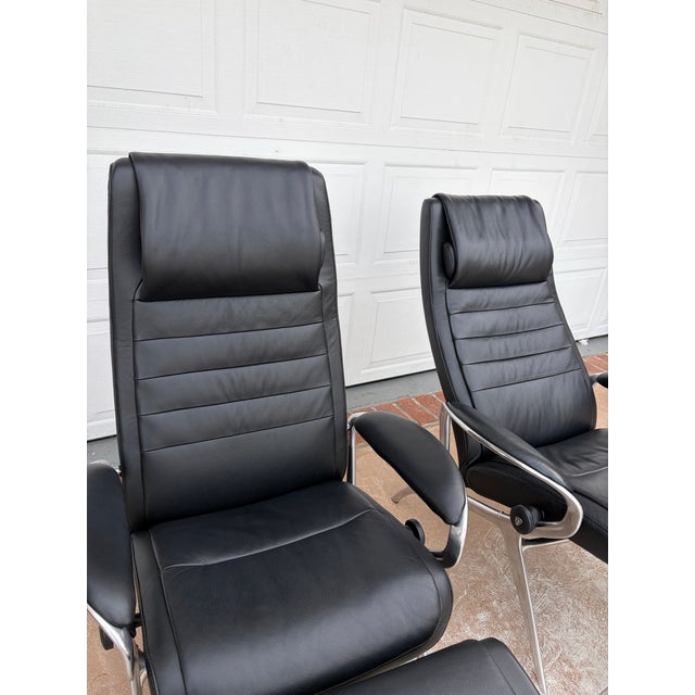 Delivery available, more than likely for free. $750 each or $1350 for both. Beautiful leather stressless reclining chairs,...