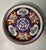 A finely decorated Japanese Imari porcelain shallow bowl dating to the late Meiji to early Taishō period, circa 1900–1920....