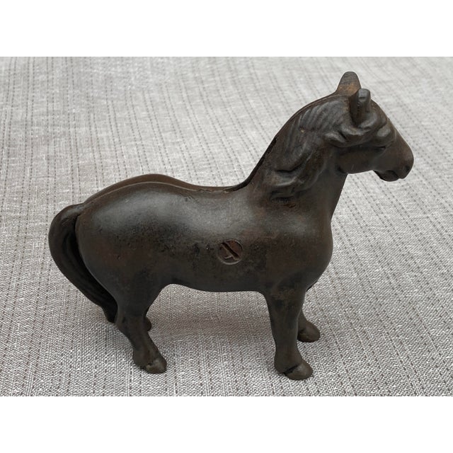 Sweet, small antique cast iron horse piggy bank. Slot on the lower part of his mane. Heavy. No marks. Great condition....