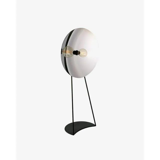 Zénith floor light, silver by radar. Design: bastien taillard. Materials: silver thermoformed glass, black matte frame,...