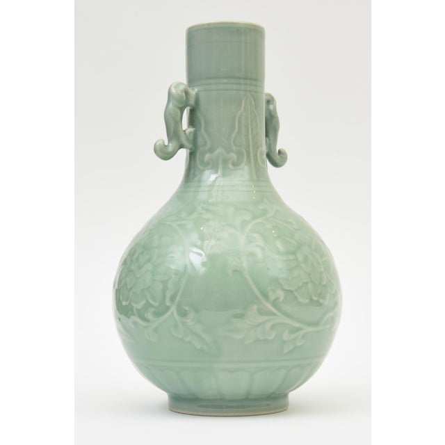 This beautiful Asian Chinese celadon green porcelain vase is vintage from the 50's. It has handles on the side with asian...