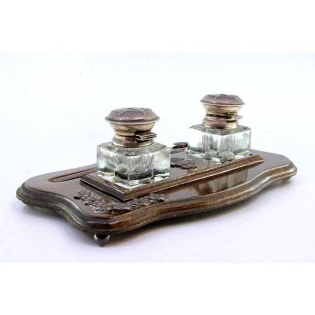 Wood and Glass Inkwell with Pen and Silver Applications, in Very Good conditions. Designed 1890 to 1919 This piece has an...