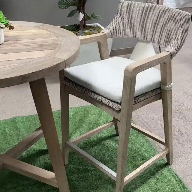 The Lucia Olefin Fabric Outdoor Counter Stool brings weather-resistant seating to patios, poolside bars, and covered...