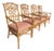 A group of four rattan armchairs by Lexington Furniture, featuring geometric fretwork backs and warm honey-toned bamboo-...