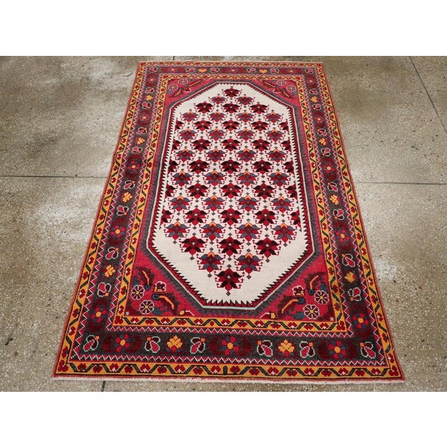 A vintage Persian Malayer throw rug handmade during the late 20th century. Measures: 3' 7" x 5' 10"