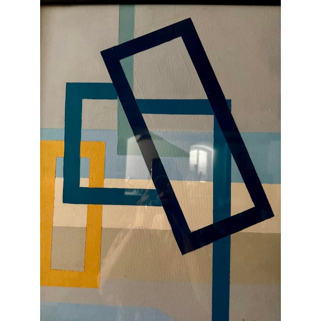 Original geometric painting by Jill Pavlas in slate gray, blues, beige and yellow/orange. Framed in a simple black wood...