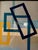 Original geometric painting by Jill Pavlas in slate gray, blues, beige and yellow/orange. Framed in a simple black wood...