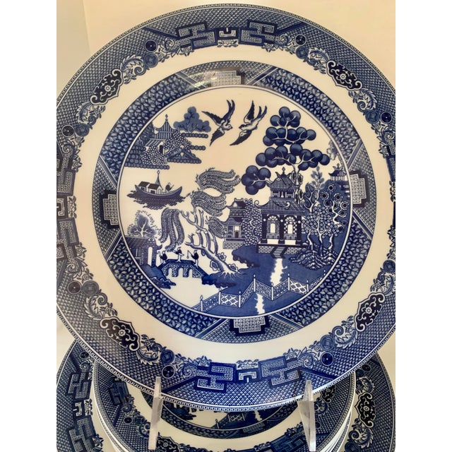 Set of dinnerware dishes made by Johnson Bros, England in the much beloved “Blue Willow” pattern. It was produced from...
