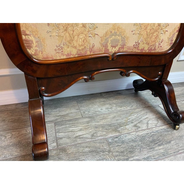 An exceptionally nice large Early Victorian era Mahogany fire screen with a beautiful French polish finish. The original...