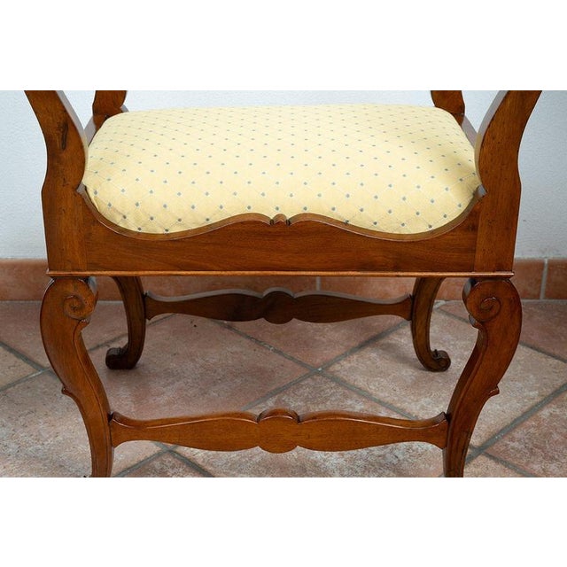 A pair of Lucca-style executive stools made of solid walnut, dating from the first half of the 19th century. The...