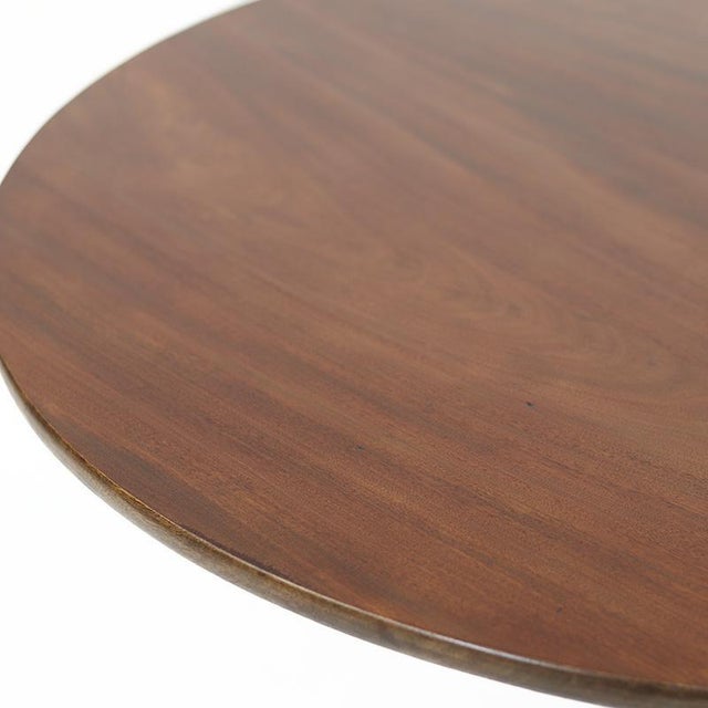 An impressive antique side table or center table made of solid mahogany, dating from around 1880. The wood has a...