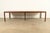 An exceptional Mid-Century Modern extension dining table in book-matched walnut By Edward Wormley for Dunbar Furniture,...