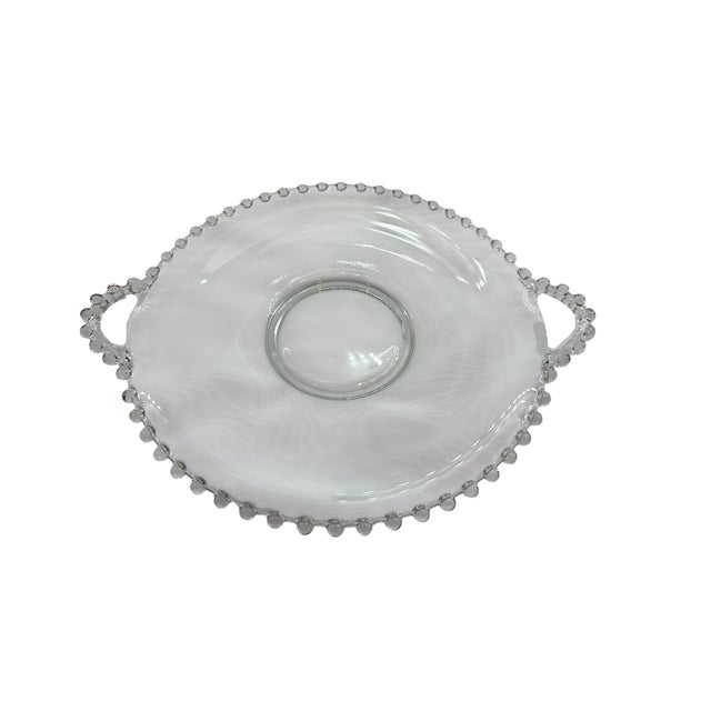 This handled plate is a versatile piece of serveware. Manufactured by Imperial Glass, it's part of the Candlewick line....