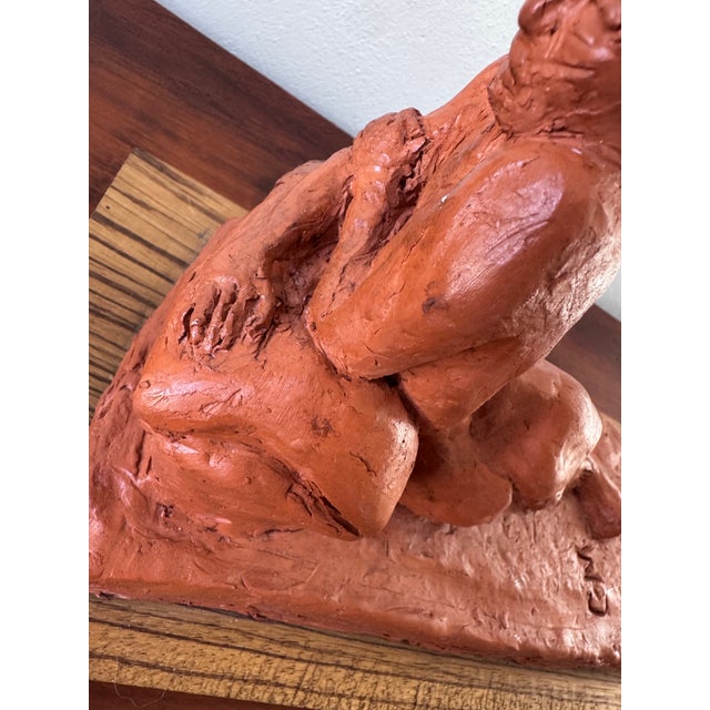 Expressive vintage clay sculpture of a reclining nude figure, mounted on a rectangular wood base and finished with a light...
