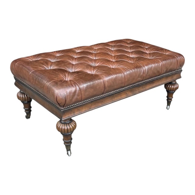 This elegant vintage leather ottoman bench embodies classic English design with a rich, timeless presence and exceptional...