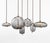 Brokis “Knot” suspension lamp in transparent smoke-grey glass, featuring an elegant brass body finishing and matching...
