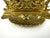This vintage French brass letter holder features an intricate Rococo design, showcasing ornate scrollwork and floral...