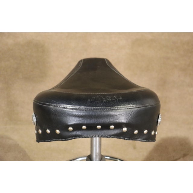 Unique factory stool with motorcycle throne as the seat. Polished chrome base with pneumatic height adjustment. H:...