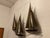 A very fine and rare brutalist brass wall art sculpture of sail boats by Curtis Jere, signed and dated 1977.