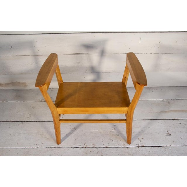 Large Scandinavian-style maple bench with armrests. The style is reminiscent of the elegant, clean lines of mid-century...