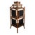 An antique English 3 tier corner etagere of burnt bamboo and black Japanned panels. Each shelf is fan-shaped and Japanned...