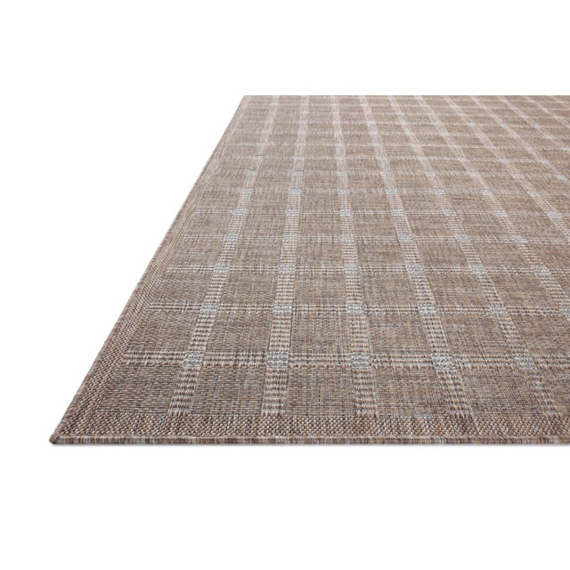 Inspired by the scenic mountain town in California, the Topanga Collection is an indoor/outdoor rug made of durable...