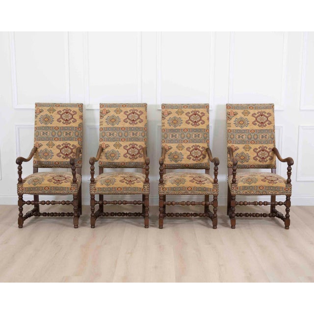 Made in France in the twentieth century, this set of four Louis XIII style armchairs has high backs in the manner of the...