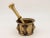 This early 20th-century mortar and pestle made of brass with an honest patina. Both the mortar and pestle are traditional...