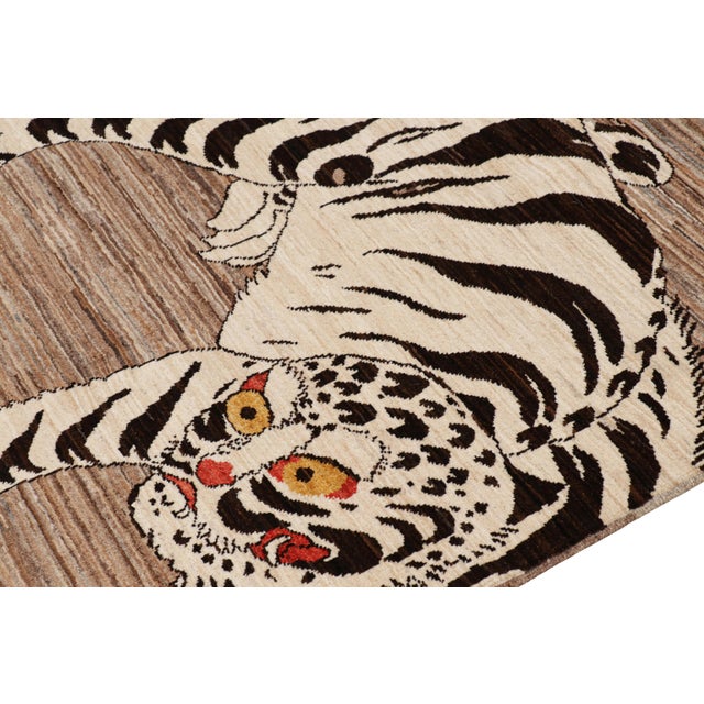Hand-knotted in wool, this 3x5 modern tiger pictorial rug is a bold addition to the Rug & Kilim Tiger rugs line of their...