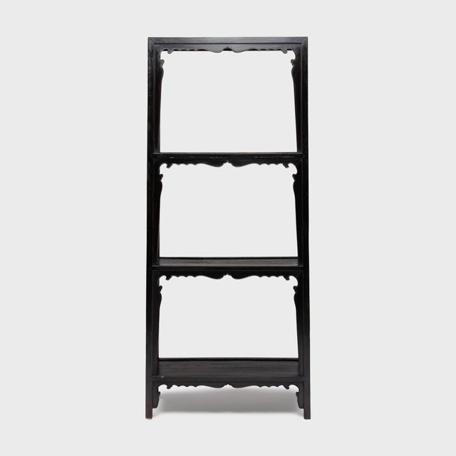 Crafted with fine detail and perfection of form, these antique Chinese collector's shelves are a statement addition to any...