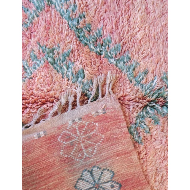 Vintage Moroccan Rug in Soft Pink with Diamond Motifs This vintage Moroccan rug is a delicate masterpiece of Berber...