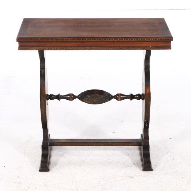 A commanding testament to old-world European elegance, this 20th-century Renaissance Revival style accent table is an...
