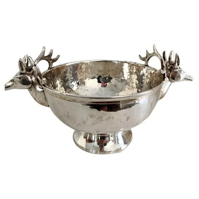 A lovely silver plate hammered bowl with Stags on either side. a compliment as a serving piece, especially for the...