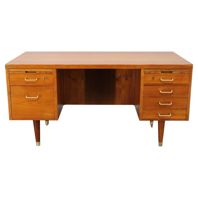 This refined mid-century writing desk was produced in Denmark during the 1960s and exemplifies the elegance and...