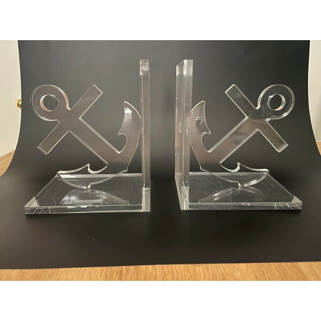 The crystal clear finish highlights the anchor motif on this pair of bookends. These will surely add a nautical or coastal...