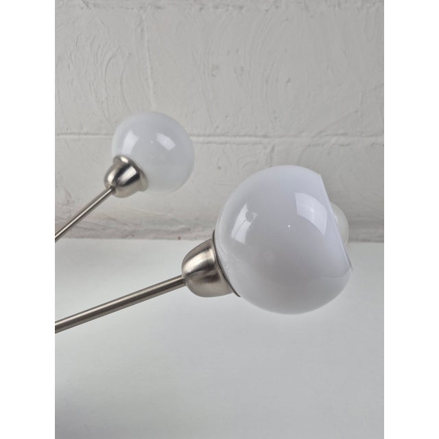 Vintage, MCM, atomic Age inspired design. Chandelier made of white, smooth milk glass and brushed stainless steel metal....