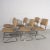 Vintage modern cantilever tubular chrome side chairs upholstered in a camel faux leather with a complimentary camel...