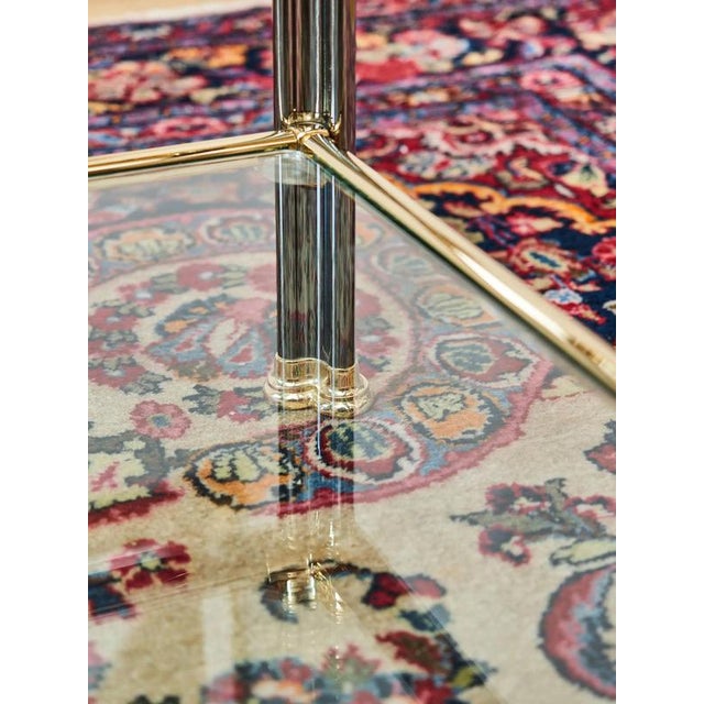 Timeless rectangular coffee table in Hollywood-regency / art-deco revival style. The frame is a combination of solid,...