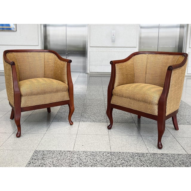 An exquisite pair of Danish Art Deco lounge chairs originally crafted in the 1930s in the style of Frits Henningsen. A mix...