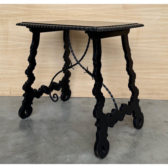 19th century Spanish trestle table in walnut. This piece has a great scale, lovely carved lyre legs and beautiful ebonized...