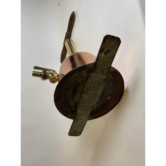 Copper and brass ocean divers auxiliary fresh air pump. With wood T handle, brass spigot with lever handle. Steel pad...