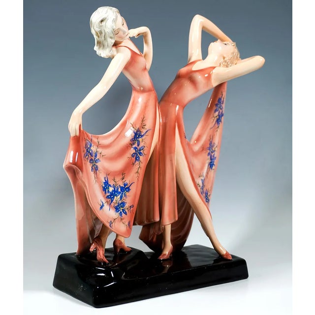 Exceptional viennese ceramic art from the 1930s: two graceful dancers in long, deeply cut and high slit rose colored...