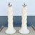 This striking pair of Postmodern table lamps features sculptural twisted column forms finished in a soft cream textured...