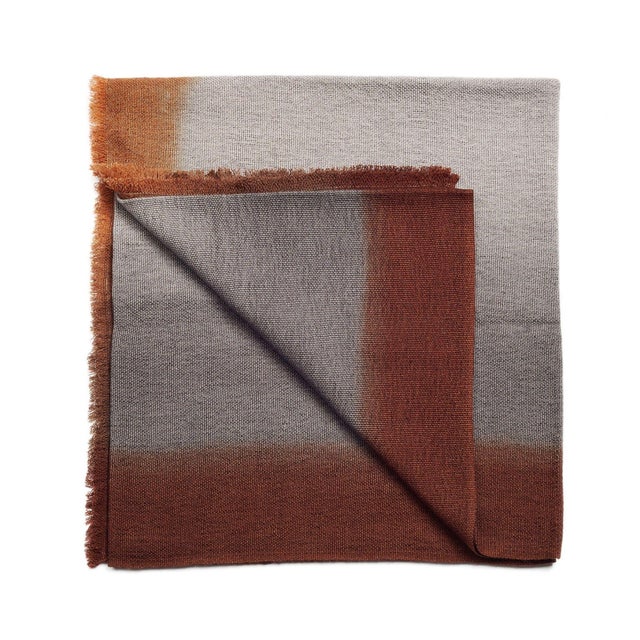 Simply Taupe handloom merino throw / blanket is handwoven by master weavers in Nepal and dip dyed entirely with certified...