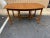 Mid Century Walnut Extendable Dining Table With 3 Leaves Features a boat- shaped top , 3 conforming leaf insertions raised...
