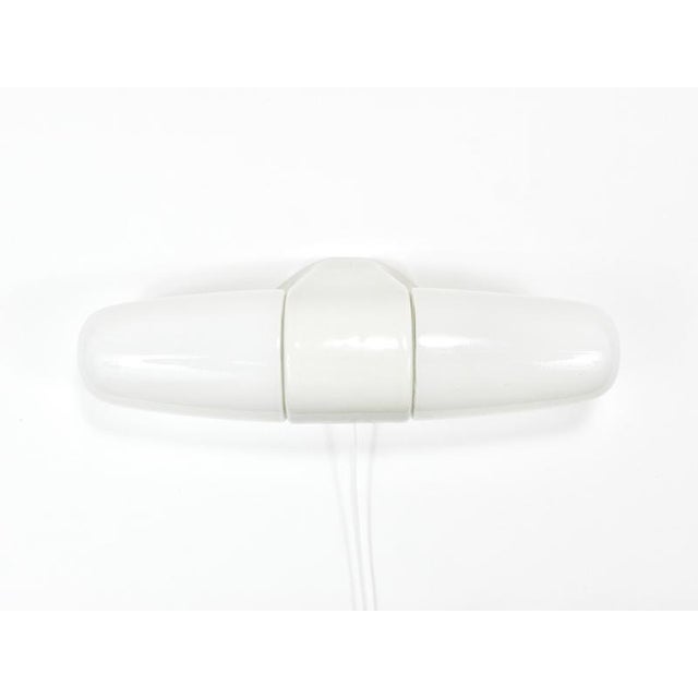 A midcentury modern double socket wall lamp/sconce dating back to the 1950s, designed by wilhelm wagenfeld. Its form...