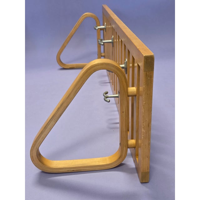 Two vintage Artek coat racks with peg joints, designed by Alvar Aalto. Dating from around the 1940s, they are in good,...