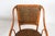 A pair of beautiful bent bamboo side chairs with woven rattan seating and back